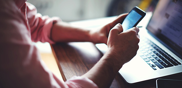 man working on smartphone